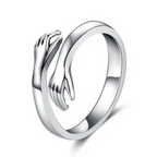 Câline | Ring med omfavnende symbol